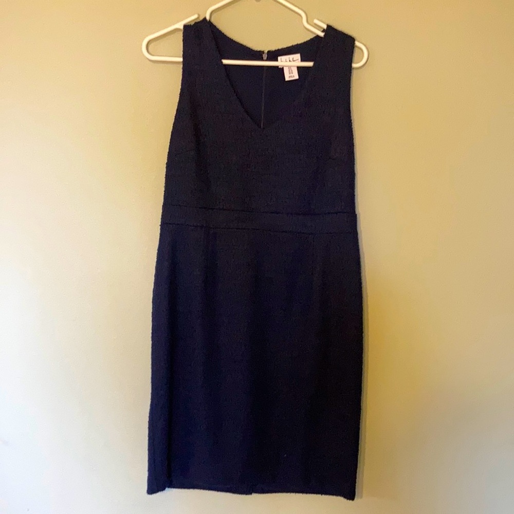 Sleeveless navy dress with patterned fabric